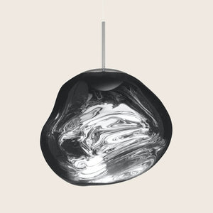 Contemporary pendant light with artistic design showcases swirling silver shades