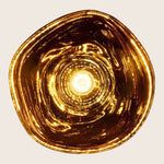 Captivating golden vortex creates a luxurious and mesmerizing visual effect.