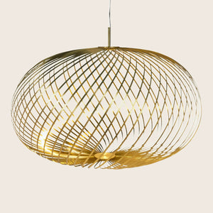 Contemporary pendant light with golden metal strips creates stunning patterns.
