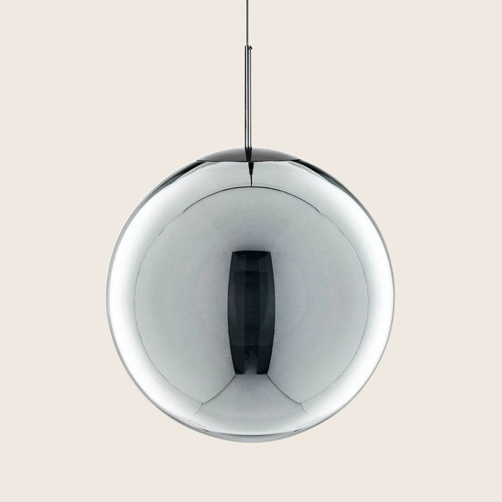 Sleek and modern pendant light fixture with reflective metallic surface.