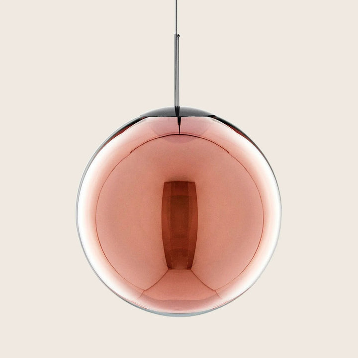 Contemporary pendant light with mirrored sphere and geometric aesthetic.