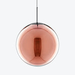 Contemporary pendant light with mirrored sphere and geometric aesthetic.