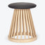 Contemporary stool with wooden dowel base and cushioned seat.