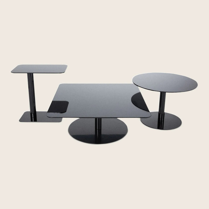 Set of three modern black tables with minimalist geometric design