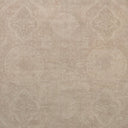 Vintage-inspired wallpaper with intricate floral motifs in soft beige tones.