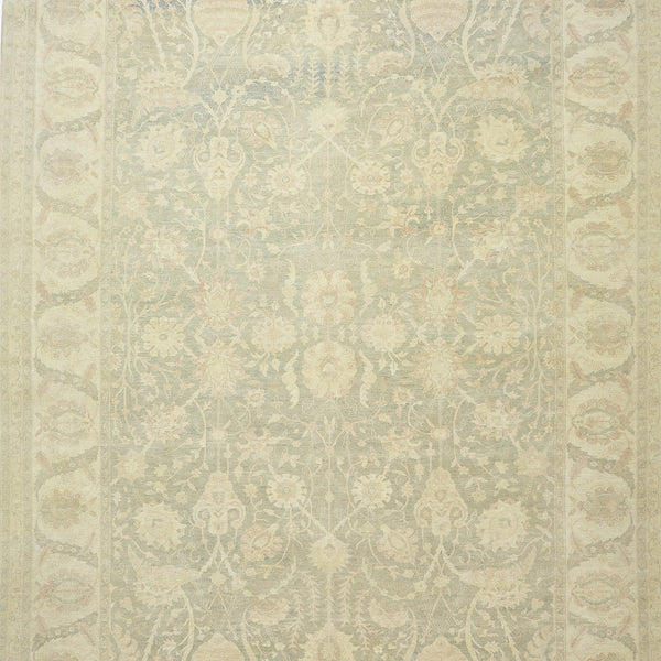 Intricately designed vintage carpet with a subdued color palette and ornamental floral motifs.
