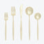 Neatly arranged gold flatware set with sleek, modern design