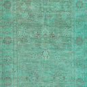 Vintage turquoise textured surface with distressed patterns for artistic projects.