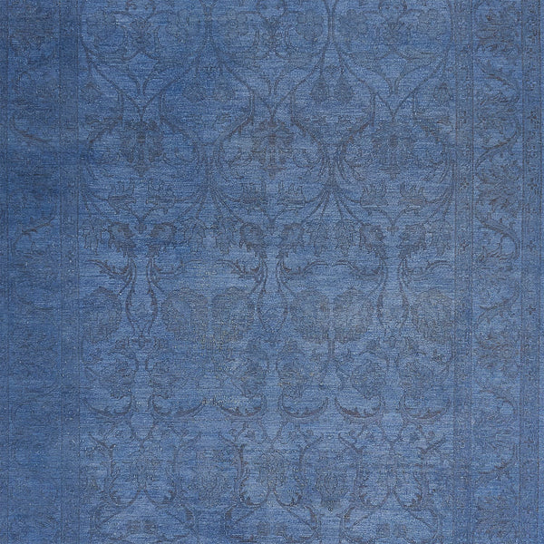 Close-up of ornate, symmetrical blue fabric with subtle sheen.