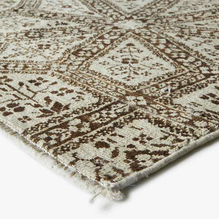 Exquisite tribal-inspired rug with detailed patterns, warm and stylish.