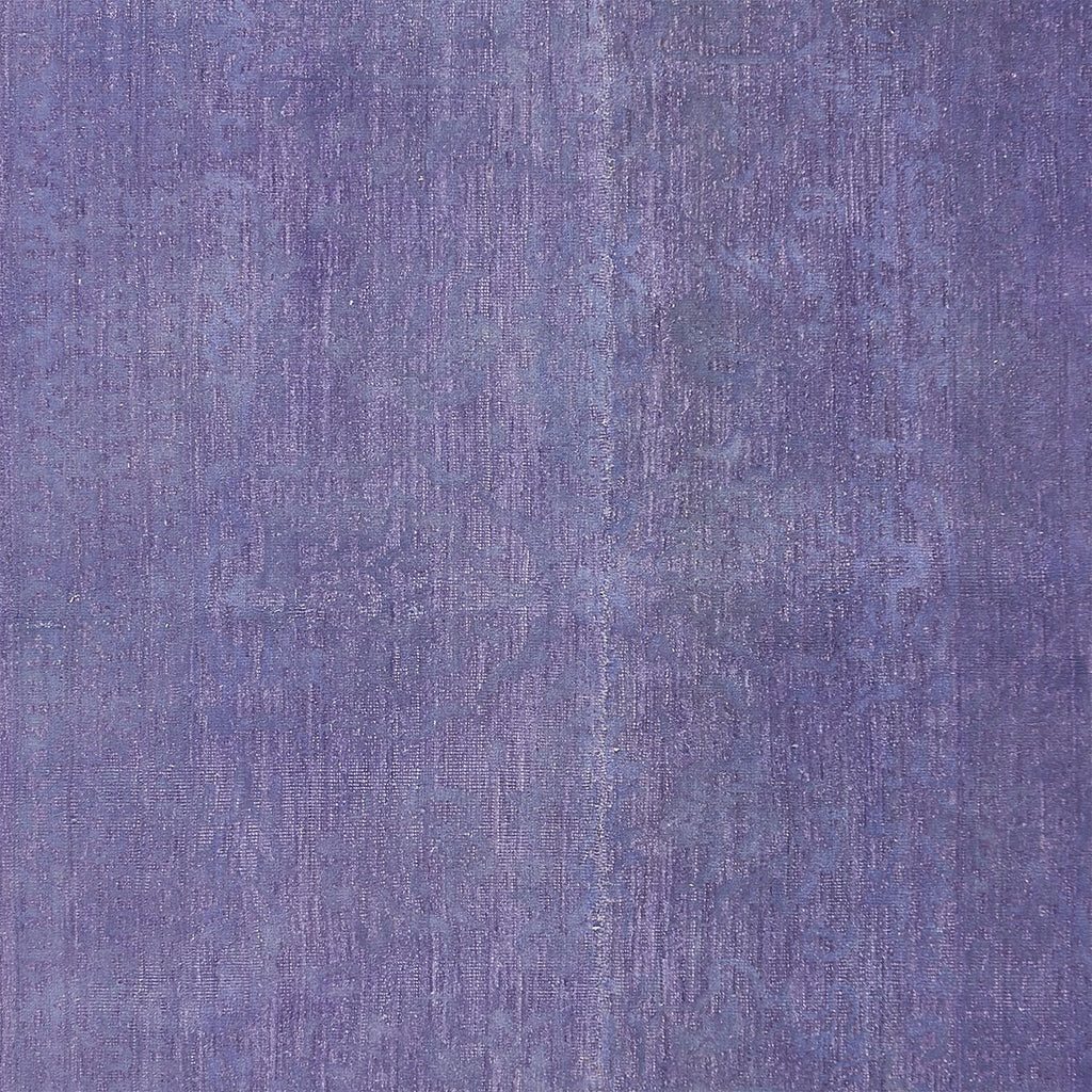 Abstract purple textured surface with subtle variations in shade.