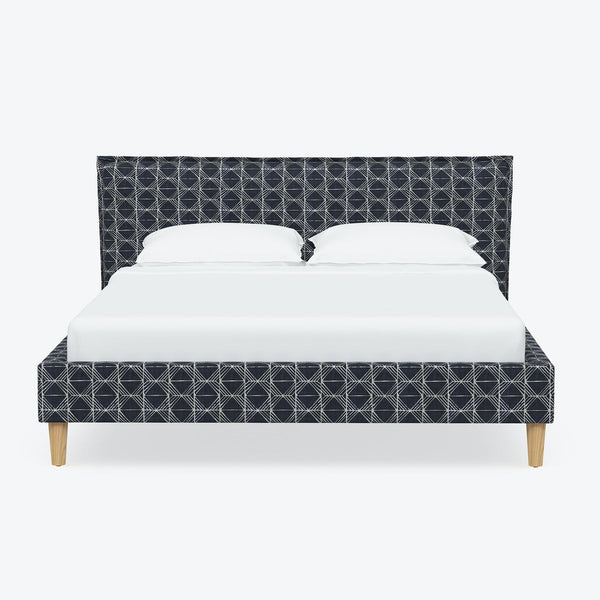 Contemporary design bed with geometric pattern in dark color scheme.