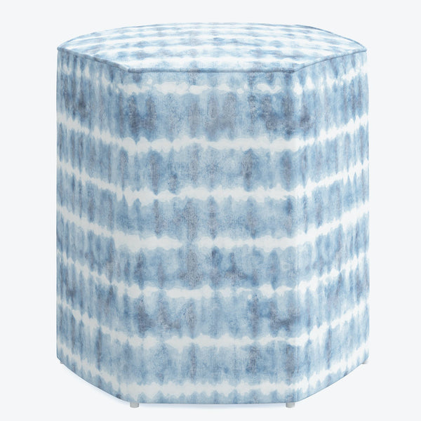 Contemporary ceramic cylinder with blue and white watercolor pattern.