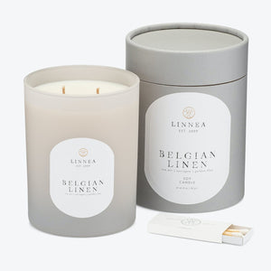 Luxurious scented candle in a glass container with elegant design. - hover