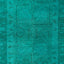 Teal and turquoise fabric with irregular texture and abstract pattern.