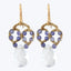 Gorgeous gold-tone dangle earrings with intricate amethyst and crystal design.