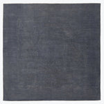 Minimalist navy textile with coarse natural fiber texture fills frame.