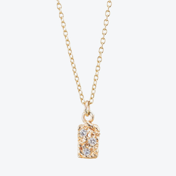 Elegant gold pendant necklace with diamond-like stones on linked chain.