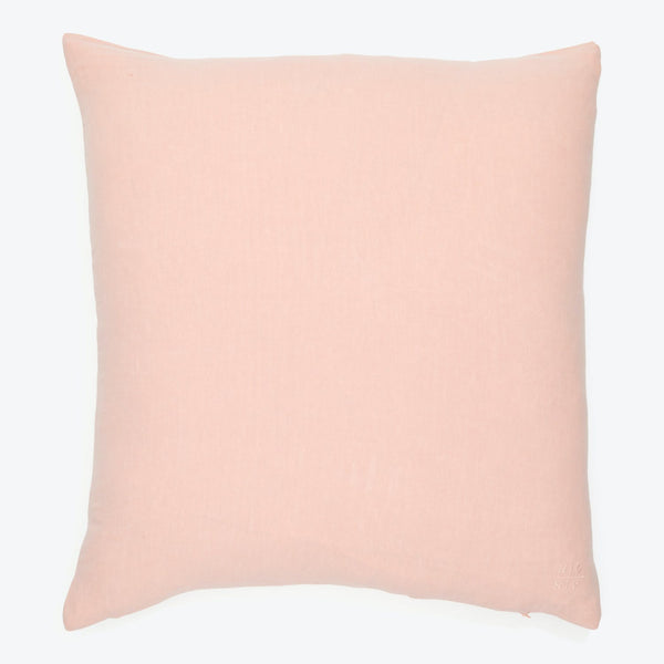 Plain light pink square pillow with minimal texture on fabric.