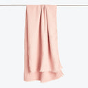 Pink textured fabric with a gentle crinkle effect gracefully draped.