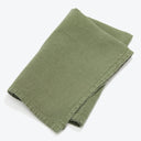 Folded olive green cotton cloth with neat hemmed edges.