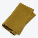 Folded olive green fabric with smooth texture and subtle sheen.
