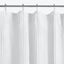 White textured curtain with visible loops hung on metal rod.