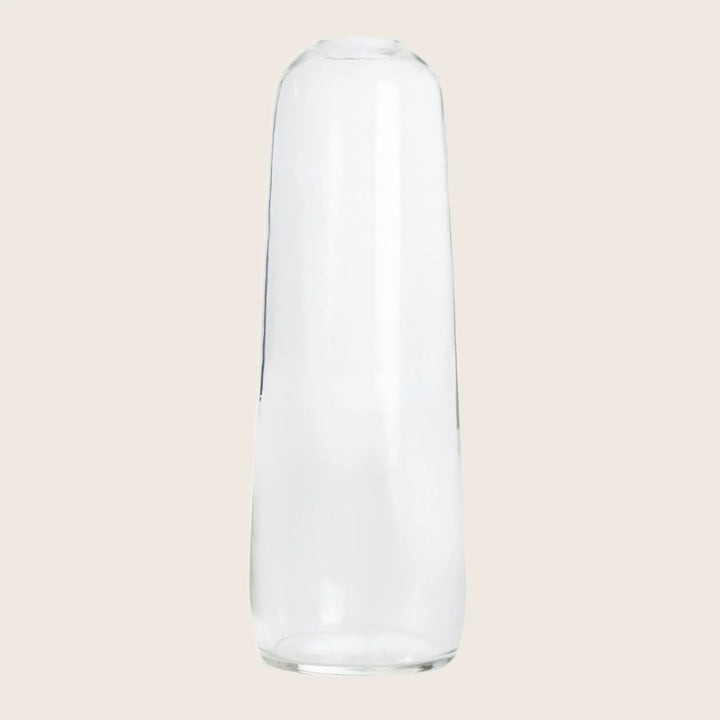 Minimalist clear glass cylinder on a white background.