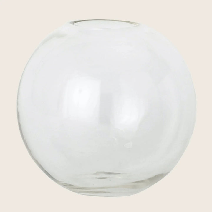 Transparent glass sphere with opening, creating elegant and minimalist design.