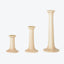 Set of elegant wooden candle holders, varying in height.