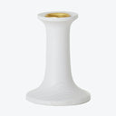 White candle holder with gold-toned insert, simple and elegant design.