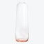Clear glass vase with pink tinted base displayed against white background.