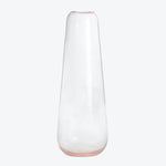 Minimalist clear glass vase with a subtle pinkish hue at base.