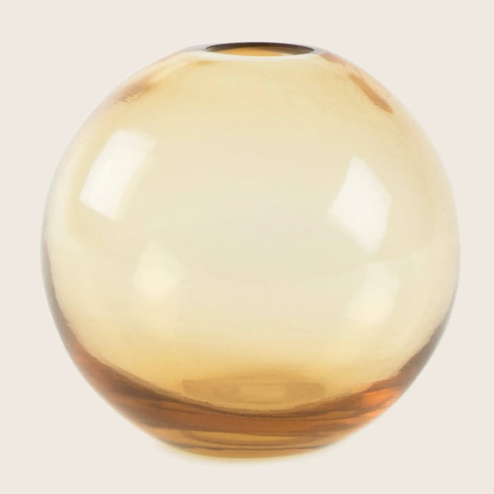 Translucent glass vase with amber tint and sleek design.