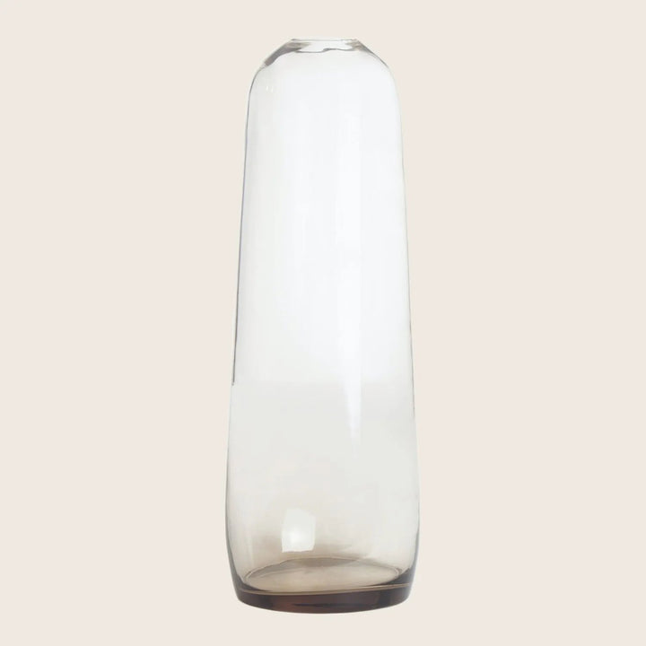 Sleek, modern glass vase with a cylindrical shape and transparency.