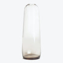 Sleek, modern glass vase with a cylindrical shape and transparency.