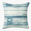 Square decorative pillow with distressed blue tie-dye pattern and metallic detail.