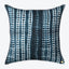 Decorative throw pillow with blue and white textured pattern design.