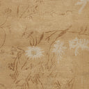 Textured floral fabric in light tan with elegant symmetrical design