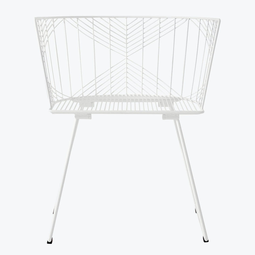 Contemporary white chair with intricate metal design for indoor/outdoor use.