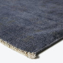 Close-up of a high-quality, plush blue carpet with textured design