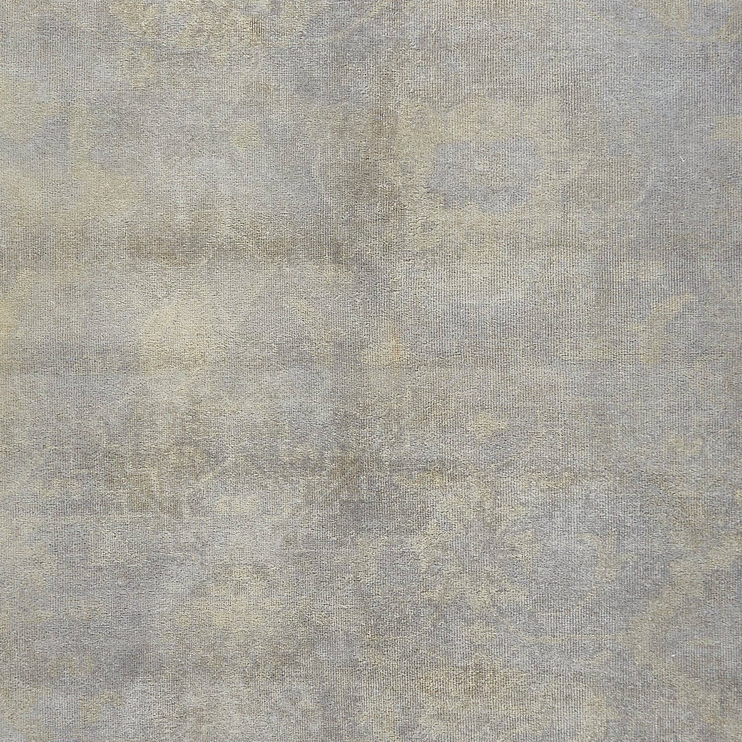 Abstract textured surface with neutral colors resembling aged weathered material.