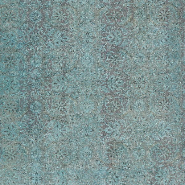 Vintage-inspired, floral medallion pattern on a textured, distressed surface.