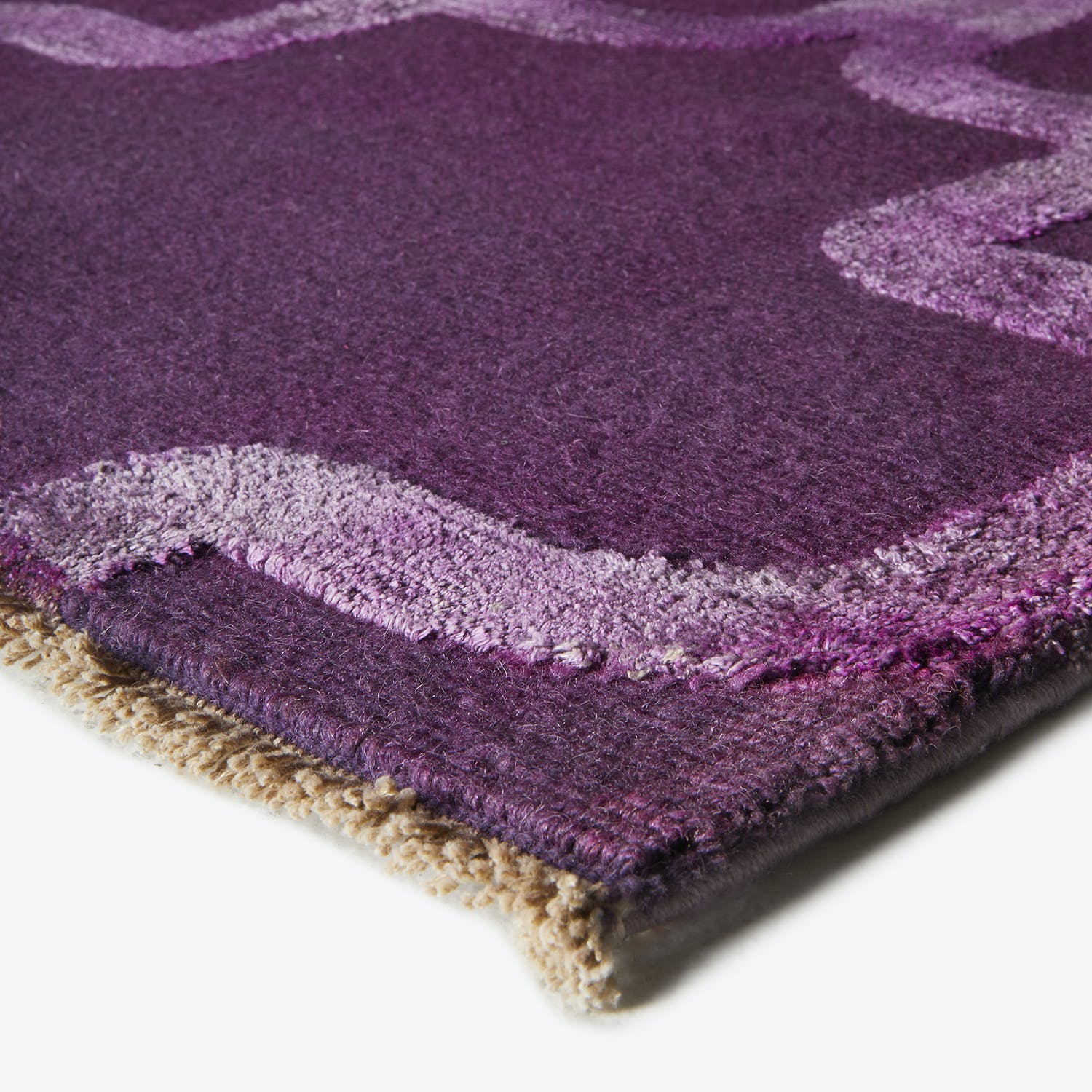 Close-up of a plush purple carpet, showcasing its soft texture.