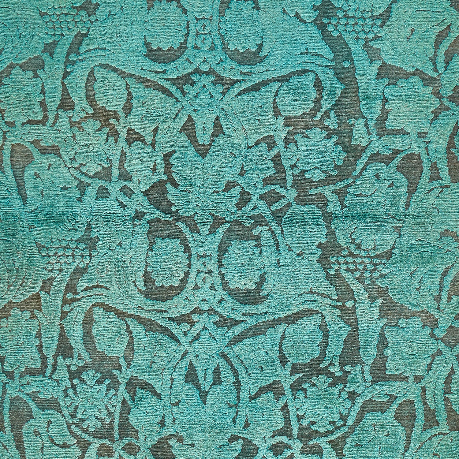 Elegant brocade fabric with intricate floral motifs and symmetrical designs.