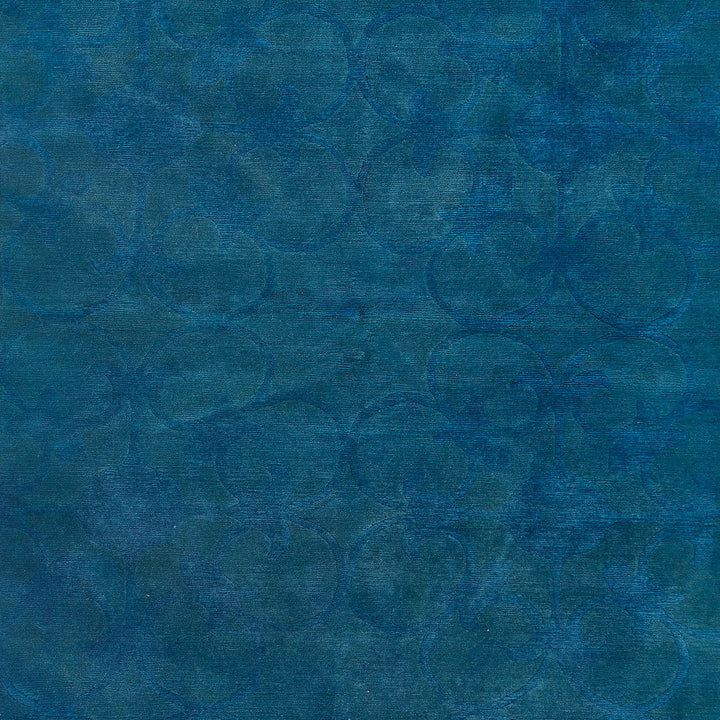 Abstract monochromatic blue pattern creates a rich and textured surface.