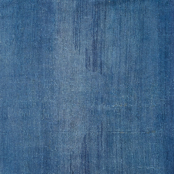 Textured blue canvas showcases smooth paint application with subtle variations.