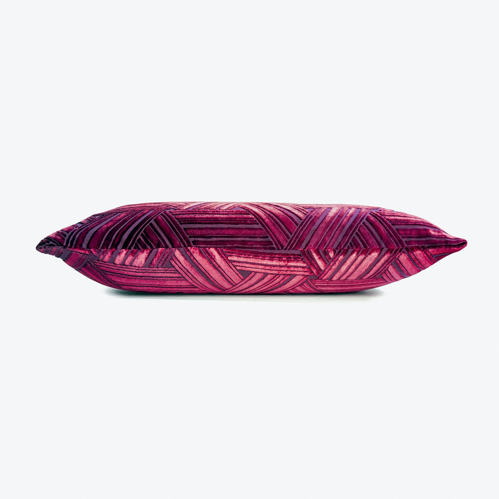 Vibrant pink and purple geometric pillow with glossy silk fabric.