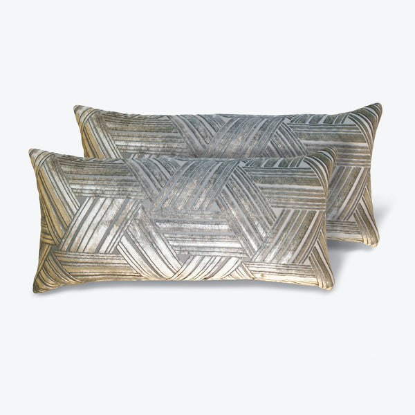 Two rectangular throw pillows with a geometric herringbone pattern.