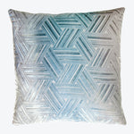 Square decorative pillow with intricate geometric pattern creates 3D illusion.